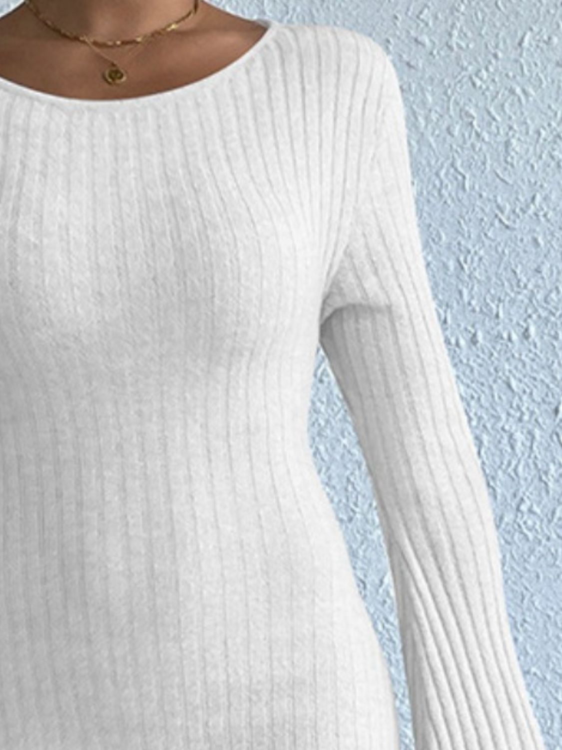 White ribbed knit long sleeve dress with bell sleeves and a scoop neckline.