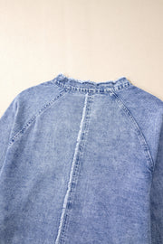 Acid wash denim shirtdress with raw hem neckline and frayed back seam detail.
