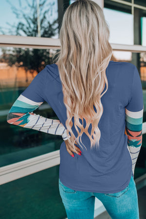Crewneck shirt in French Blue with Aztec print long sleeves and striped details.