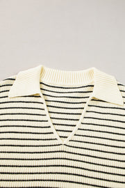 Ivory and black striped knit polo vest with a V-neck and pointed collar.