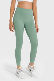 Green high-waist performance leggings with ankle length and a sculpted fit.