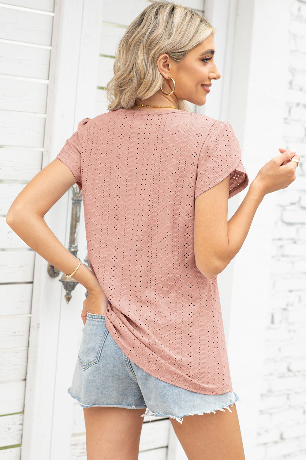 Dusty pink eyelet detail flutter sleeve blouse with breathable fabric.