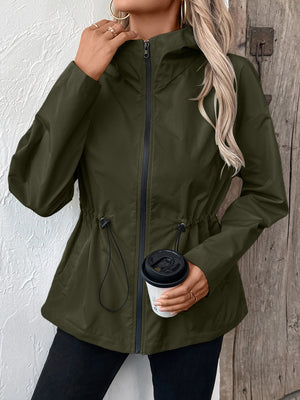Army green utility jacket with cinched waistline and hood.