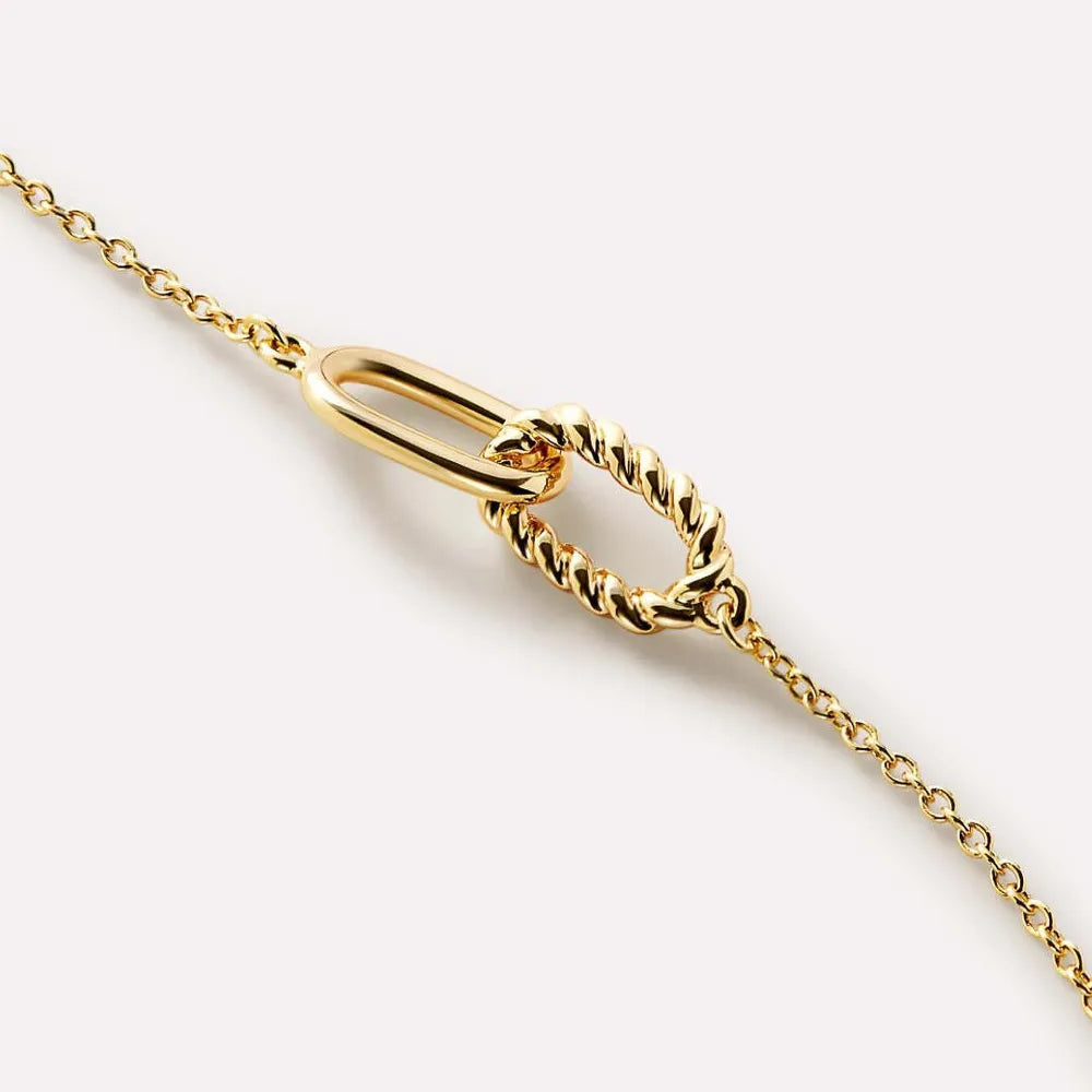 Gold interlocked link necklace with a smooth oval and a twisted oval link.