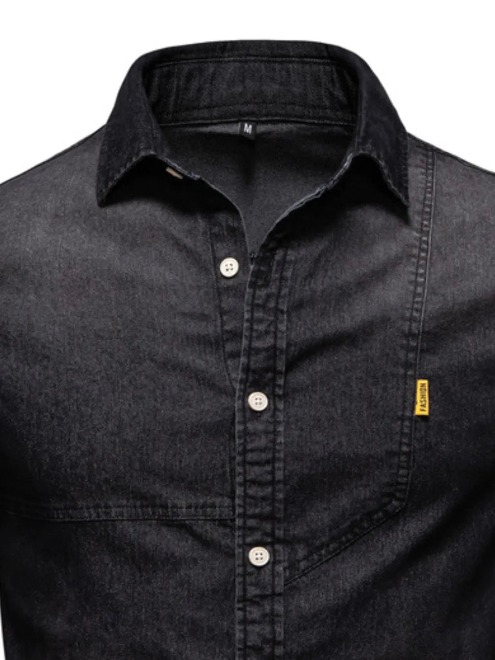 Dark wash denim shirt with asymmetric pocket detail and button-down front.