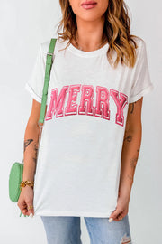 White t-shirt with pink varsity "MERRY" embroidery and cuffed sleeves.