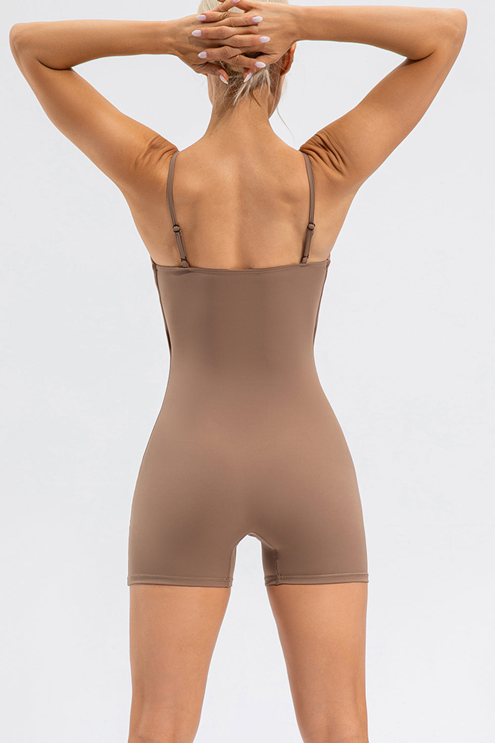 Sculpted bodysuit romper in khaki with spaghetti straps and short legs.