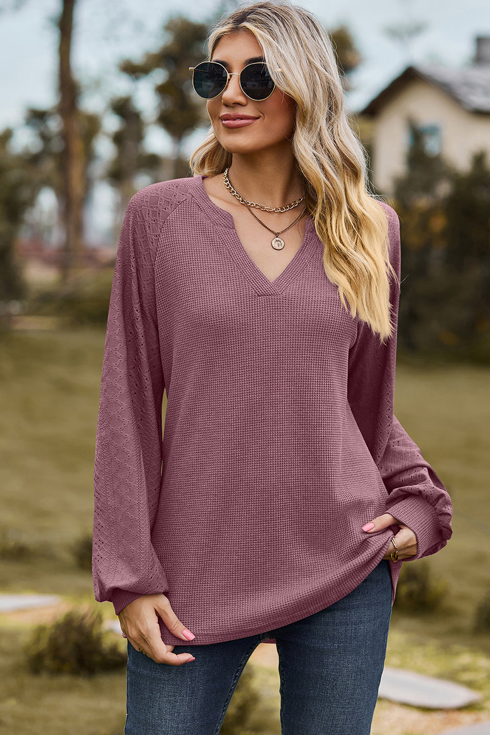 Burgundy waffle knit raglan v-neck top with eyelet detail on sleeves.