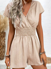 Textured wrap romper in Dust Storm with smocked waist and short sleeves.
