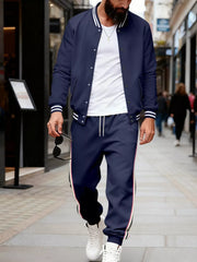 Navy track pants with side stripe detail and drawstring waist.