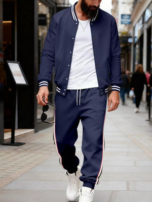 Navy track pants with side stripe detail and drawstring waist.