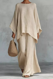 Beige polyester two-piece set with flowing top and wide-leg pants with side slits