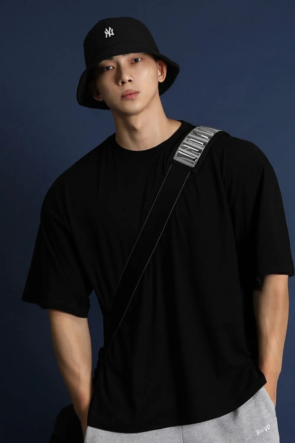 Oversized black crew neck t-shirt with a modern silhouette and short sleeves.