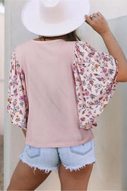 Maternity crew neck shirt in pink with floral patchwork sleeves.