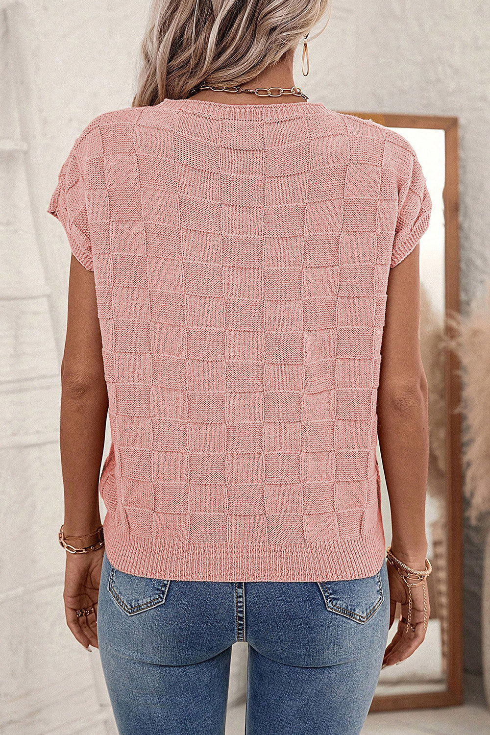 Dusty pink square-knit short sleeve tee with crew neck and textured checkerboard pattern.