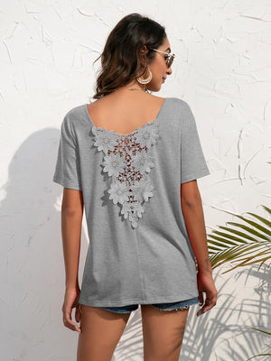 Grey t-shirt with floral lace back detail and short sleeves.