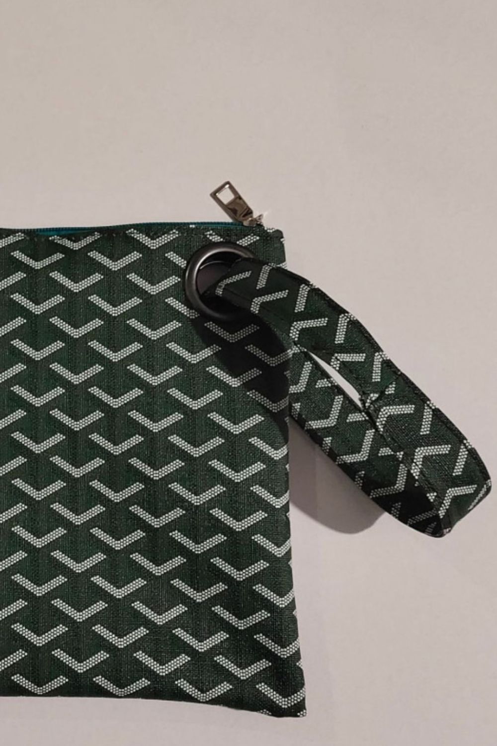 Army green plaid print wristlet clutch with grommet detail and zipper