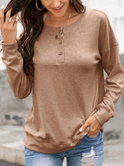 Camel henley sweatshirt with drop shoulders and button placket detail.