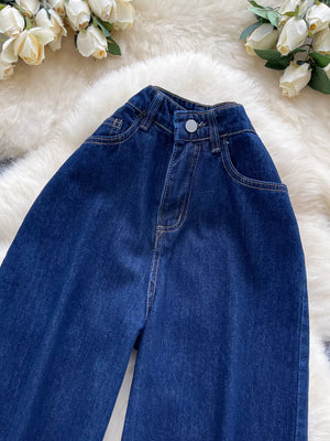 Dark wash maternity jeans with high-rise and wide leg cut in denim.