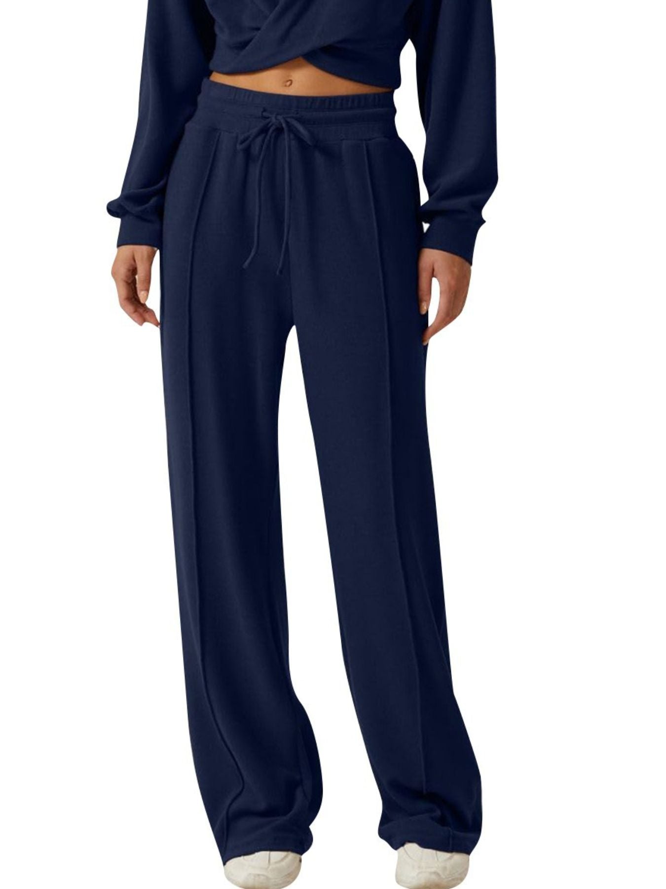 Dark blue relaxed fit pants with drawstring waist and front seam detail.