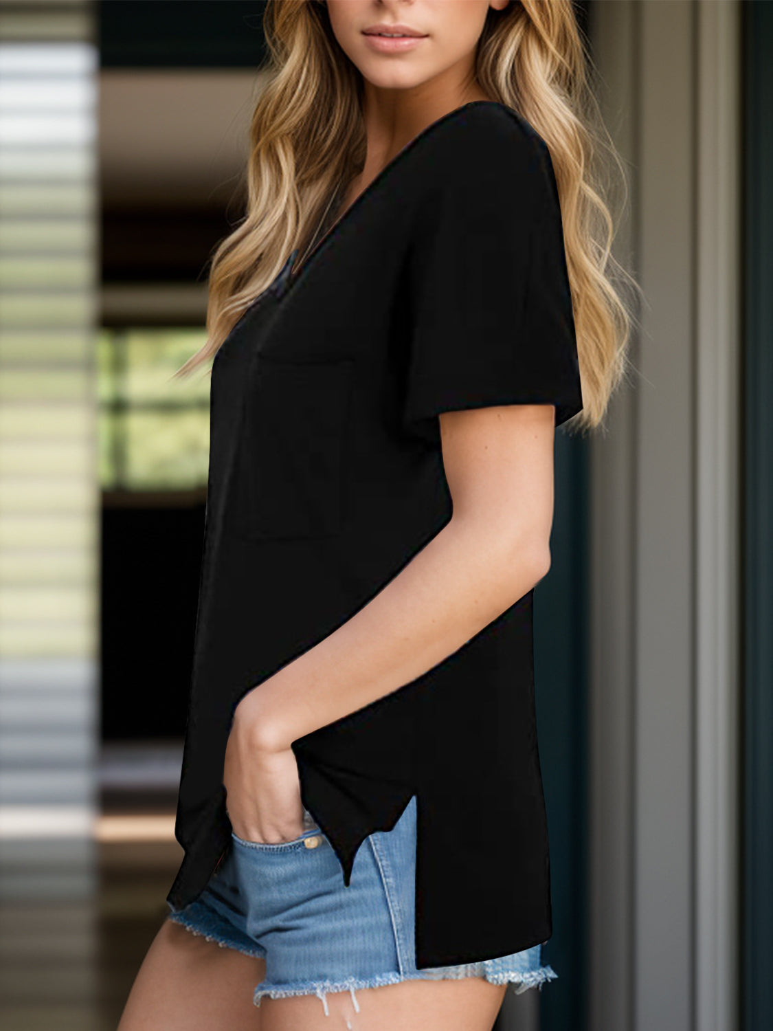 Black relaxed fit V-neck tee with chest pocket and side slits