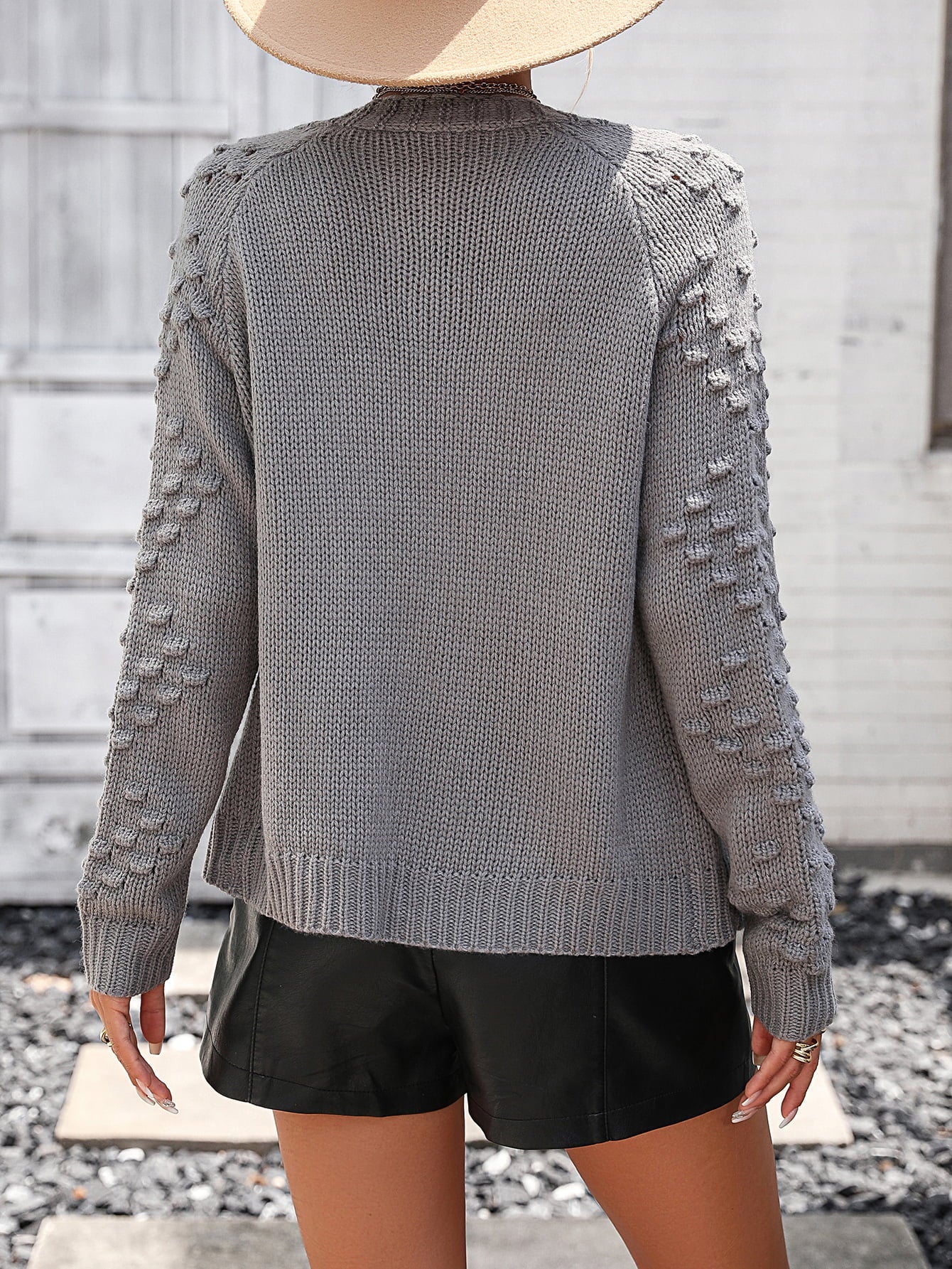 Dark Gray acrylic cardigan with textured sleeves and ribbed cuffs.
