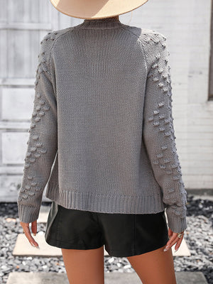 Dark Gray acrylic cardigan with textured sleeves and ribbed cuffs.