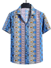 Men's blue short sleeve buttoned shirt with a colorful abstract print and vertical stripes.