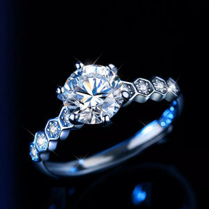 Radiant moissanite silver ring with a large center stone and honeycomb band detail.