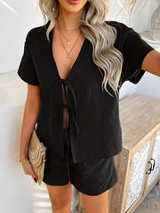 Black linen tie-front top and shorts set with short sleeves and V-neckline.