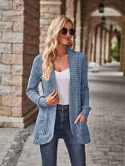 Light blue textured ribbed open-front cardigan with pockets and a relaxed fit.