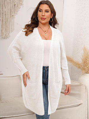 White oversized ribbed knit duster cardigan with pockets and long sleeves.