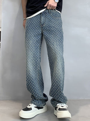 Relaxed fit blue denim jeans with allover textured pattern and vintage wash.