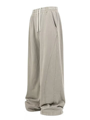Luxe drawstring wide leg sweatpants in light gray with pockets and contrast stitching.
