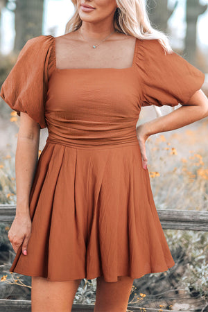 Ochre square neck romper with puff sleeves and a cinched waist