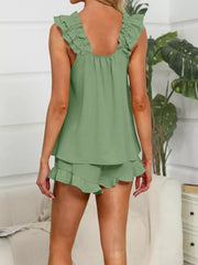 Light blue ruffled pajama set with cami and shorts.