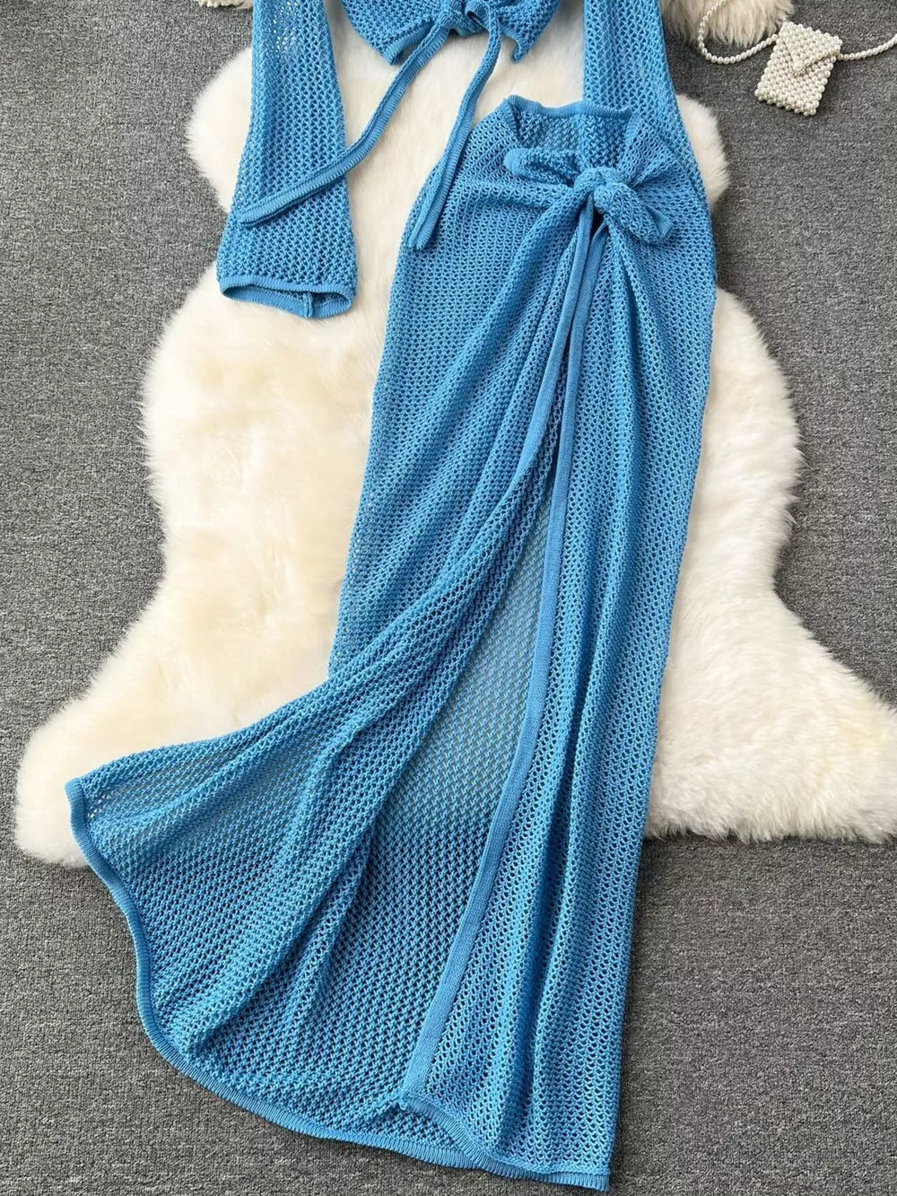Blue crochet knit tied crop top and high slit maxi skirt set.
