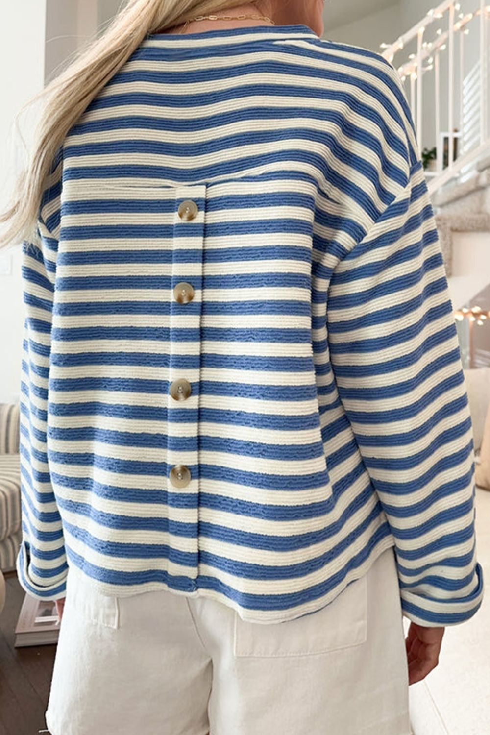 Textured stripe henley top in peacock blue with button back detail.