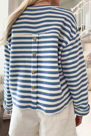 Textured stripe henley top in peacock blue with button back detail.