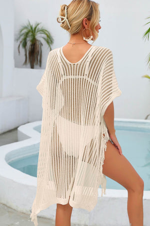 White open-knit beach cover-up with fringe detail and V-neck.
