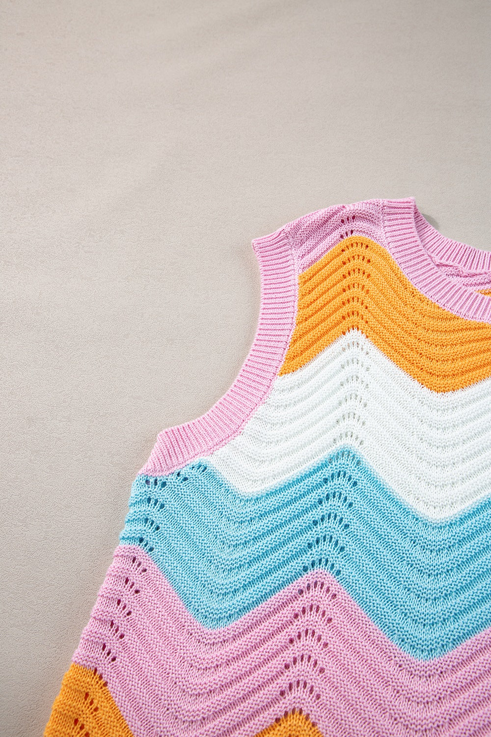 Chevron knit tank top with pink, orange, white, and blue stripes and open knit details.