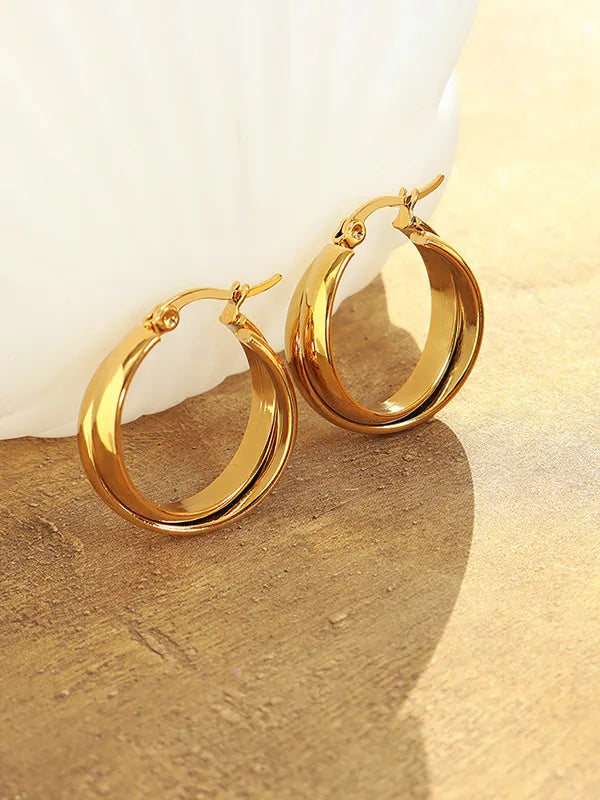 Gold double-band hoop earrings with a sculpted design