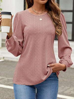Dusty Pink perforated puff sleeve blouse with crew neck and cinched cuffs.