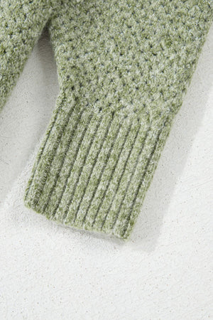 Matcha green open-knit slouchy V-neck sweater with ribbed cuffs and textured knit detail.