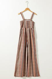 Striped square neck wide-leg romper with smocked bodice and adjustable straps.