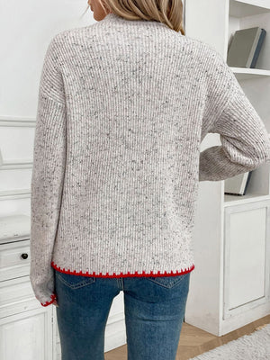 Light gray ribbed knit sweater with speckled detail and red trim
