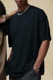Black half sleeve t-shirt with raw edge neckline and sleeves.