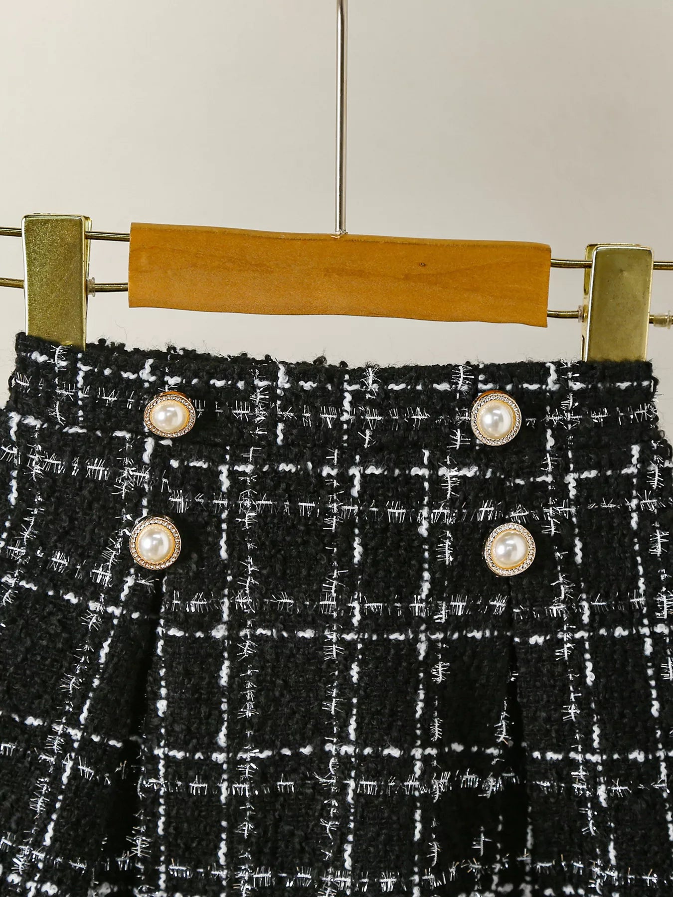 Black plaid tweed skirt with pearl button detail