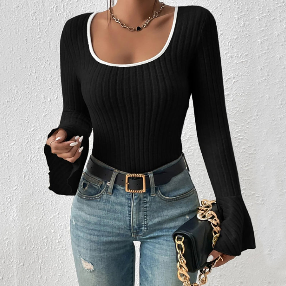 Black ribbed flare sleeve top with contrast white neckline and cuffs.