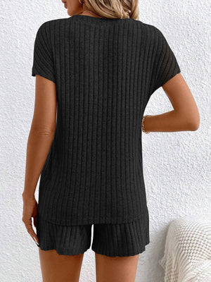 Black ribbed knit lounge set with short sleeves and shorts.